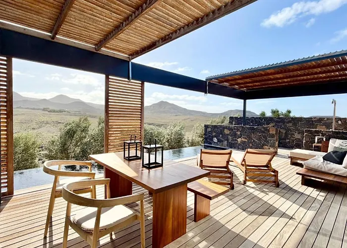 Wake Up To Nature In Modern Glass House Villa